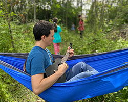 Doctor Parry in Hammock playing ukulele